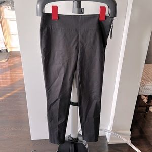 Marciano black trousers stretchy with side zip.